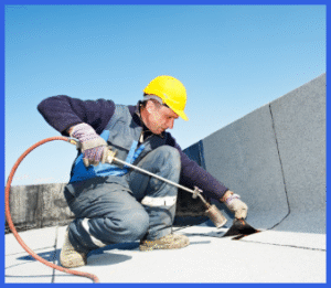 Professional Roofer Installing Shingles