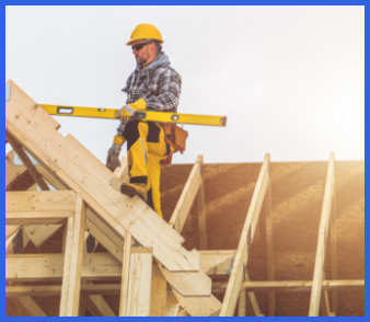 Construction worker carefully measuring roof frame