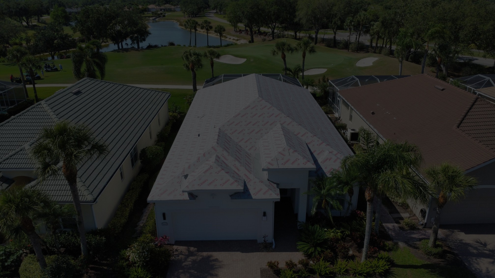 Residential roofs near golf course with mixed materials