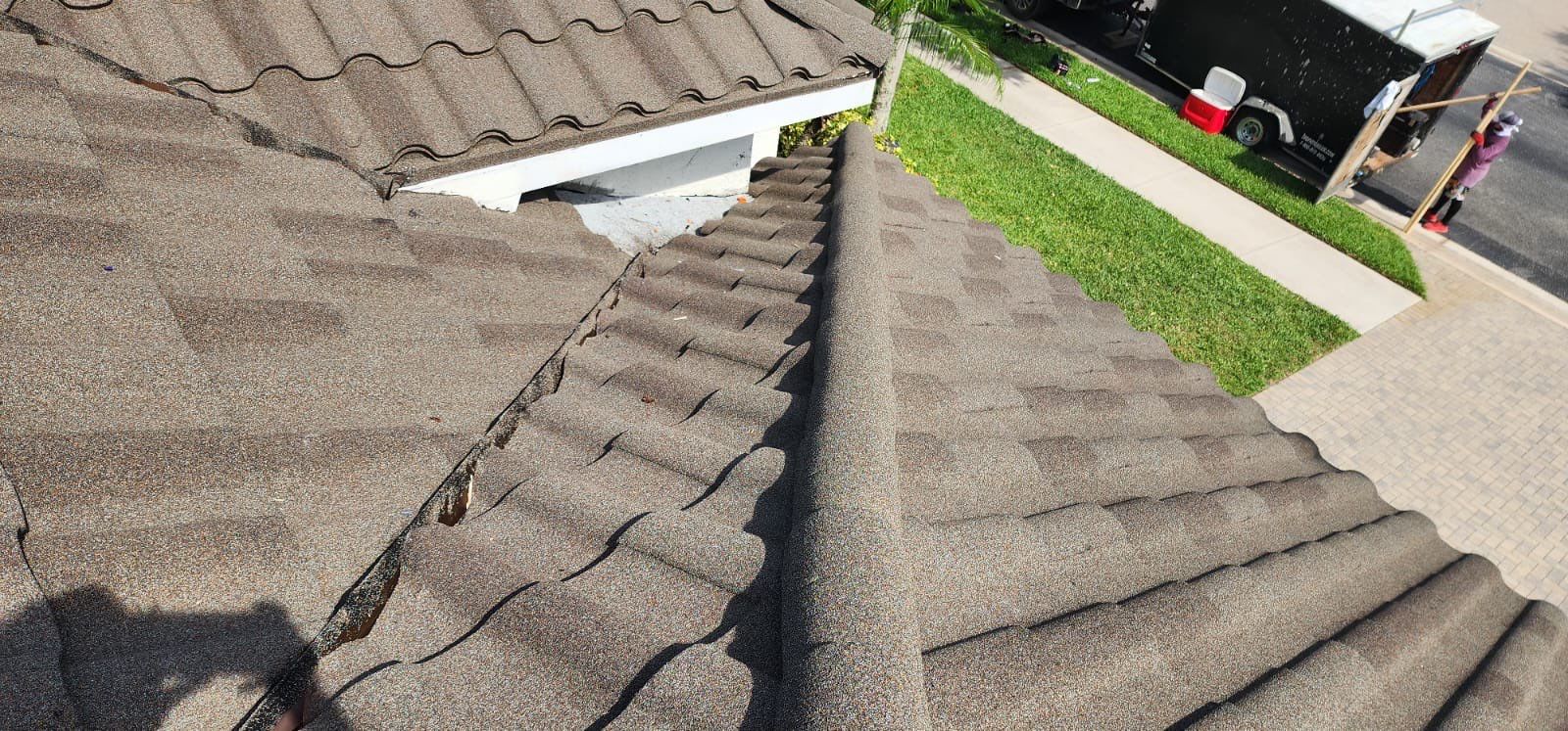 Damaged roof with worn shingles requiring repair
