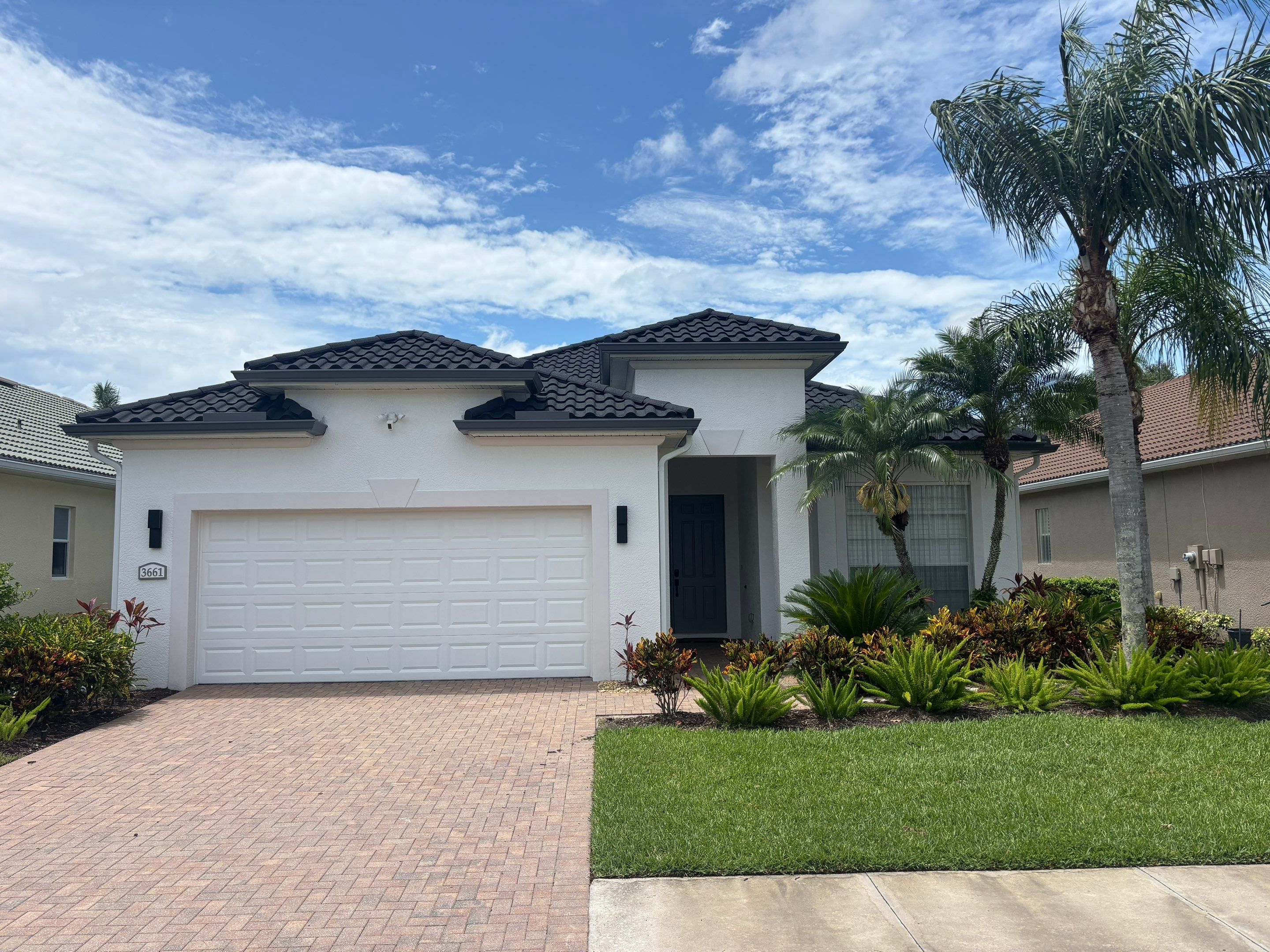 Red metal roof luxury home completed