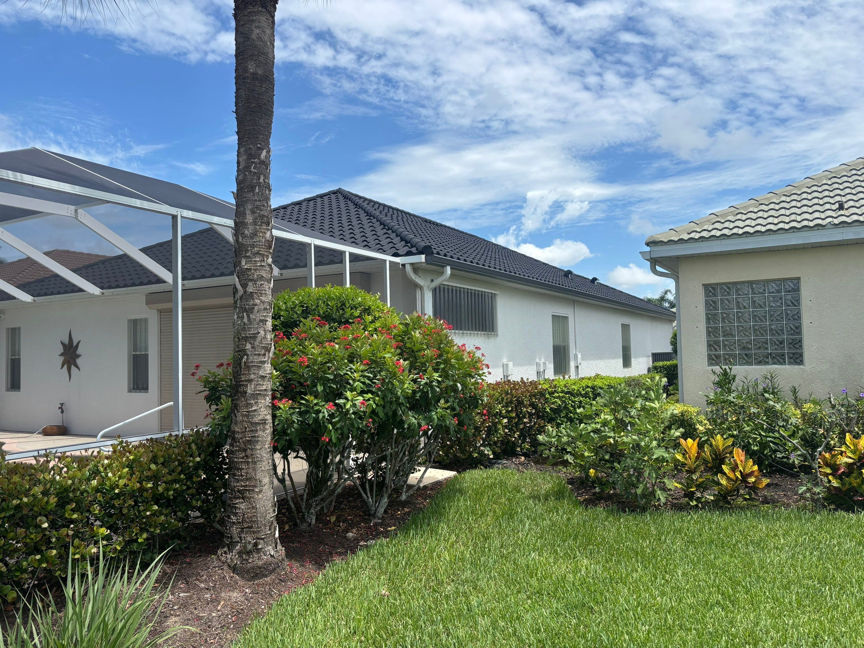 Plywood roof deck installation worker with tools