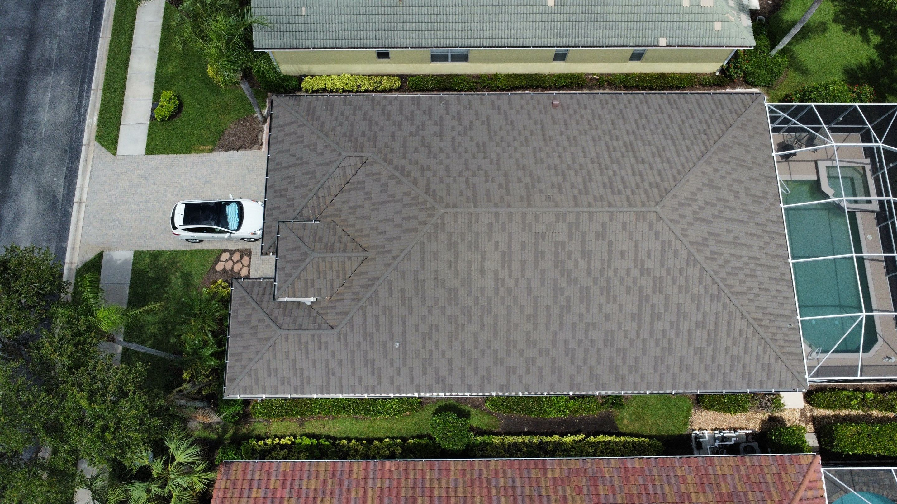 Aerial view of large residential hip style roof