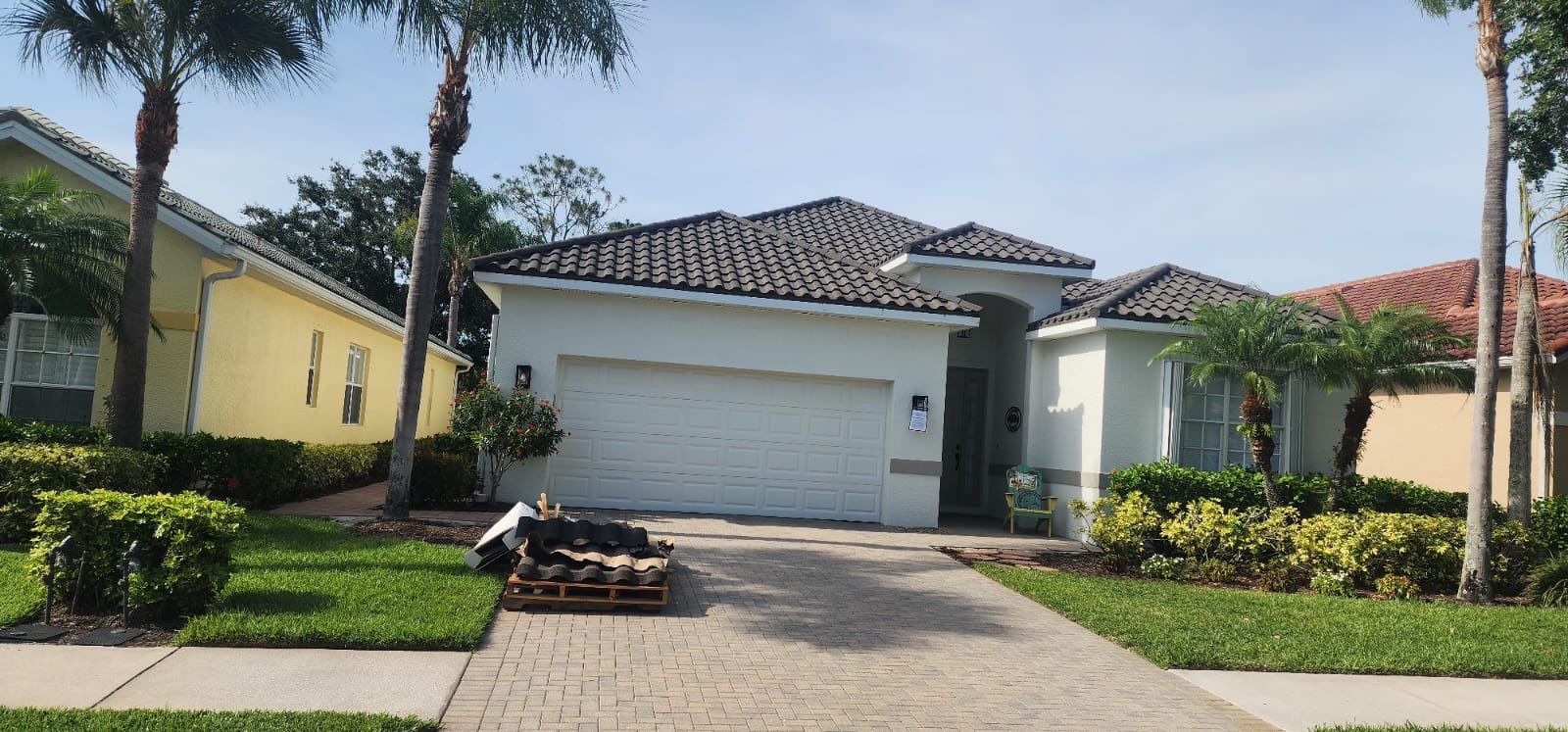 Residential house with tile roof white home